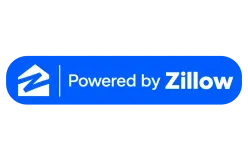A blue rounded rectangle with a white house symbol on the left and the words Powered by Zillow in white and blue text on the right.