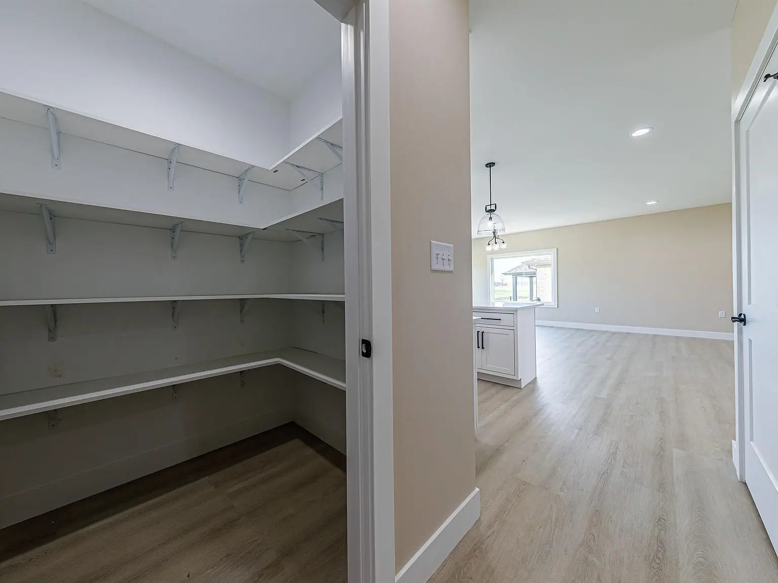 View of a walk-in pantry in the DaVinci floor plan by Chris Brown Homes 18739 Roscommon Rd.