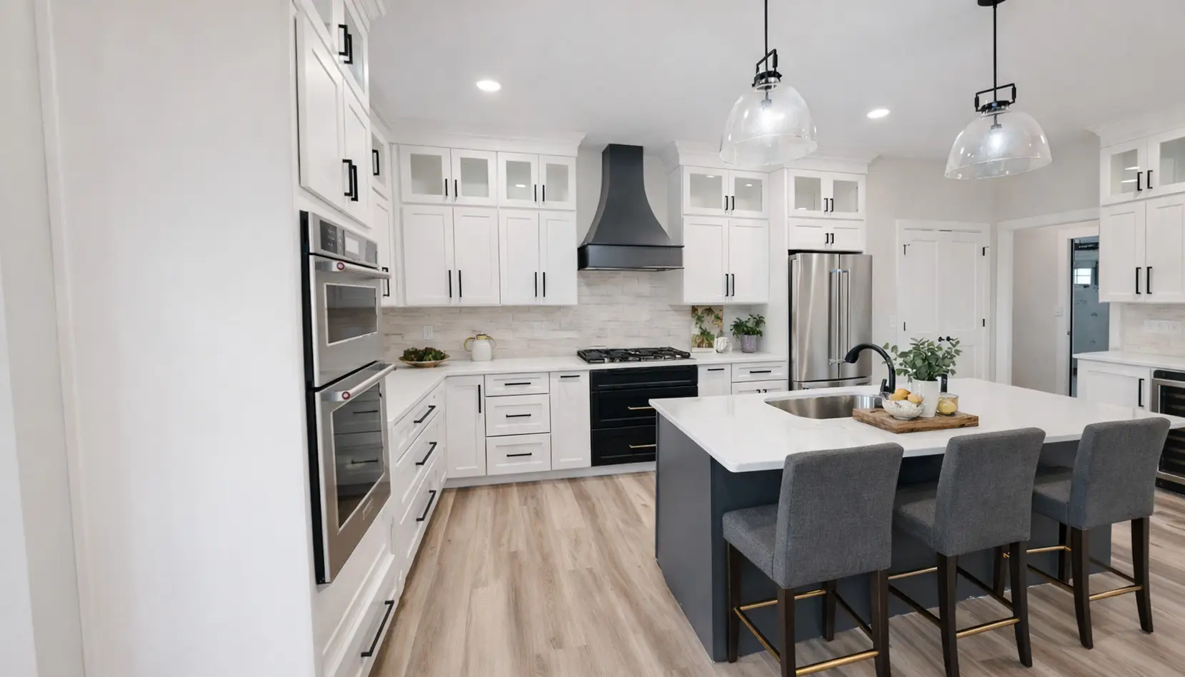 Modern Aurora Kitchen With Black Island and White Cabinets