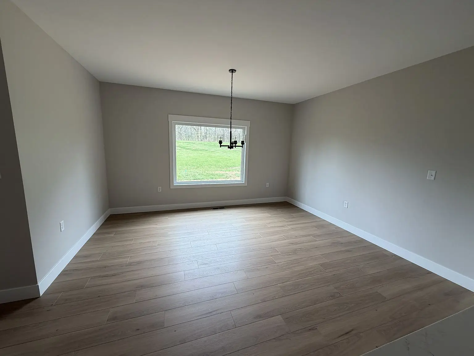 Spacious empty room in the Robin floor plan at Chris Brown Homes 6192 Ashford Cir.