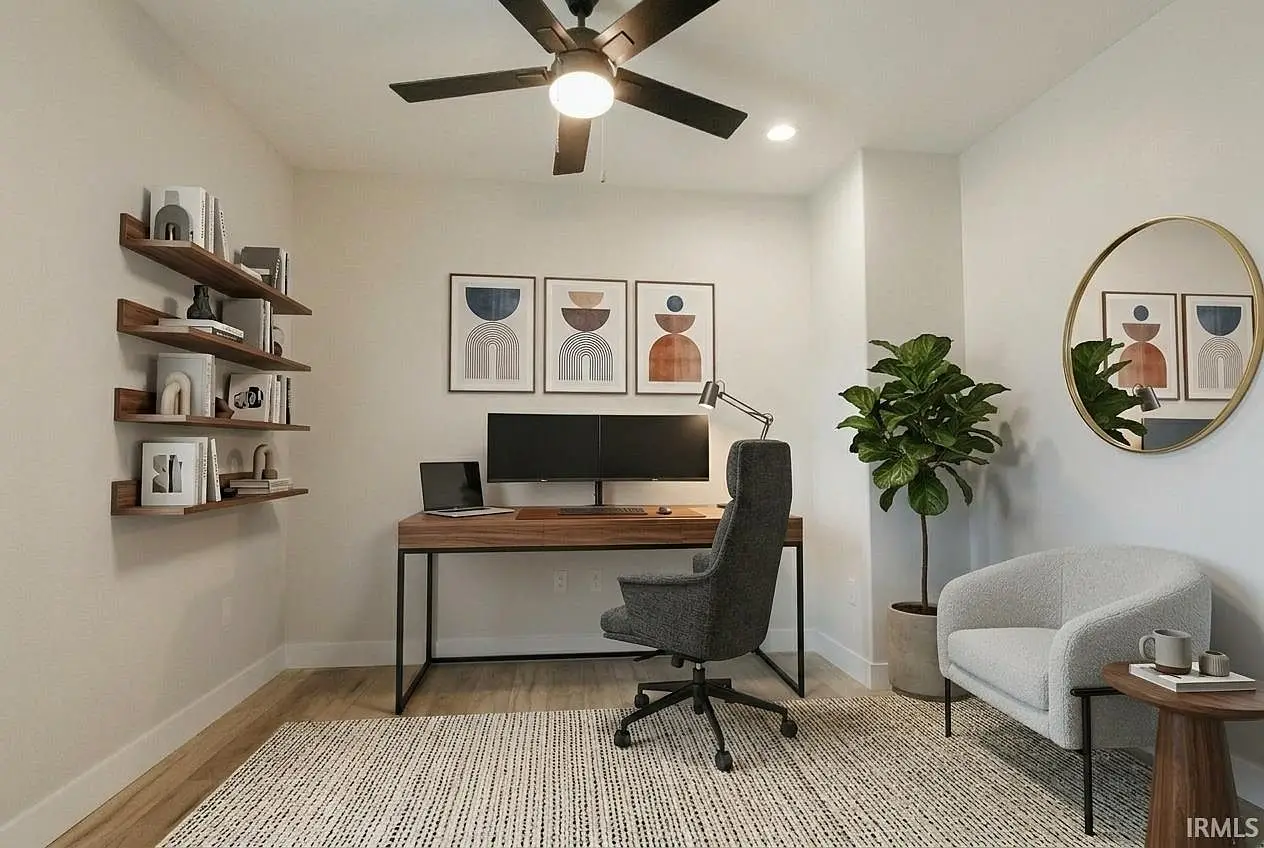 Home office with desk, chair, dual monitors—part of the Asher floor plan by Chris Brown Homes.