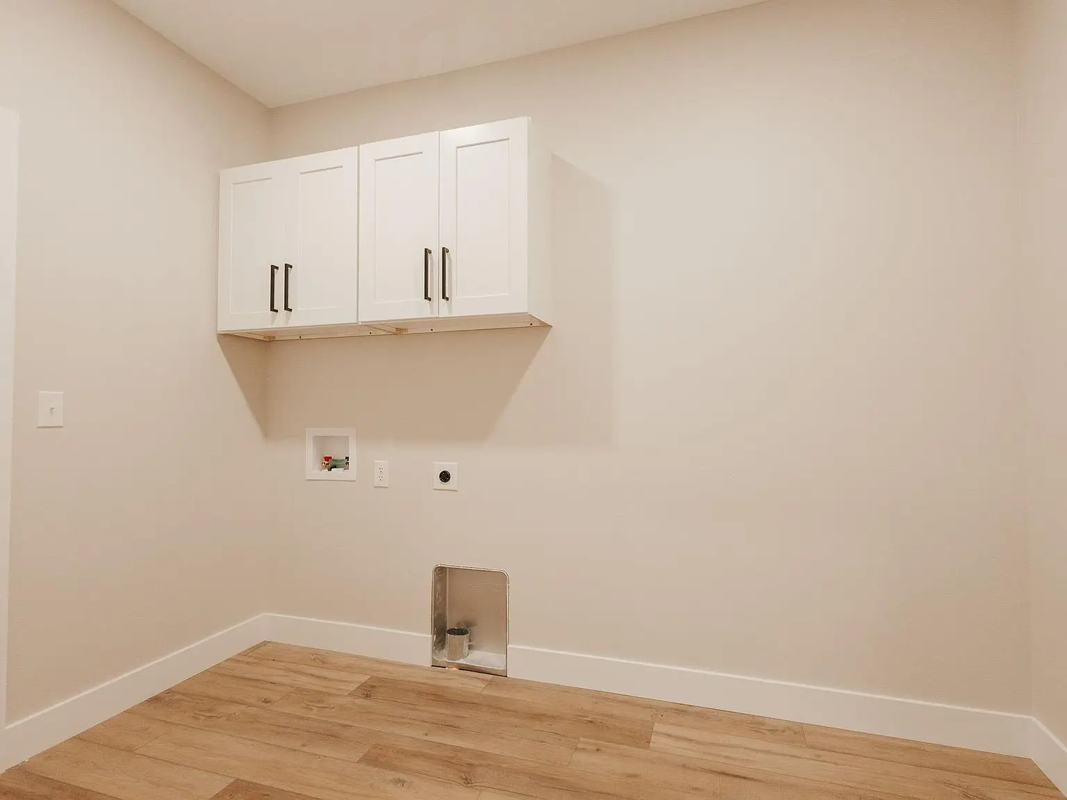 Part of the Asher floor plan by Chris Brown Homes at 18801 Roscommon Rd, light wood floors shine.
