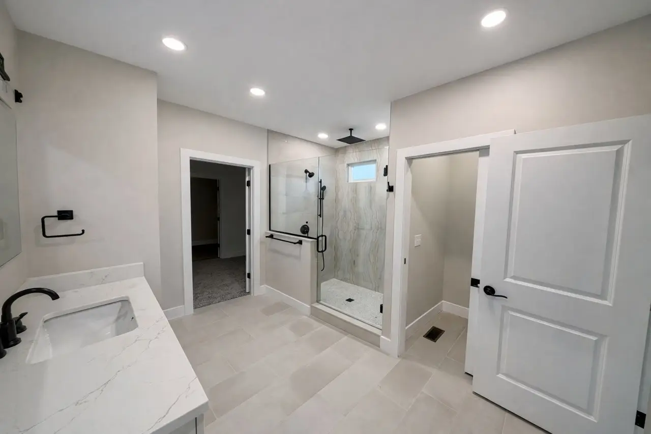 Modern bathroom with glass shower in the Asher floor plan by Chris Brown Homes 18622 Wicklow Way.