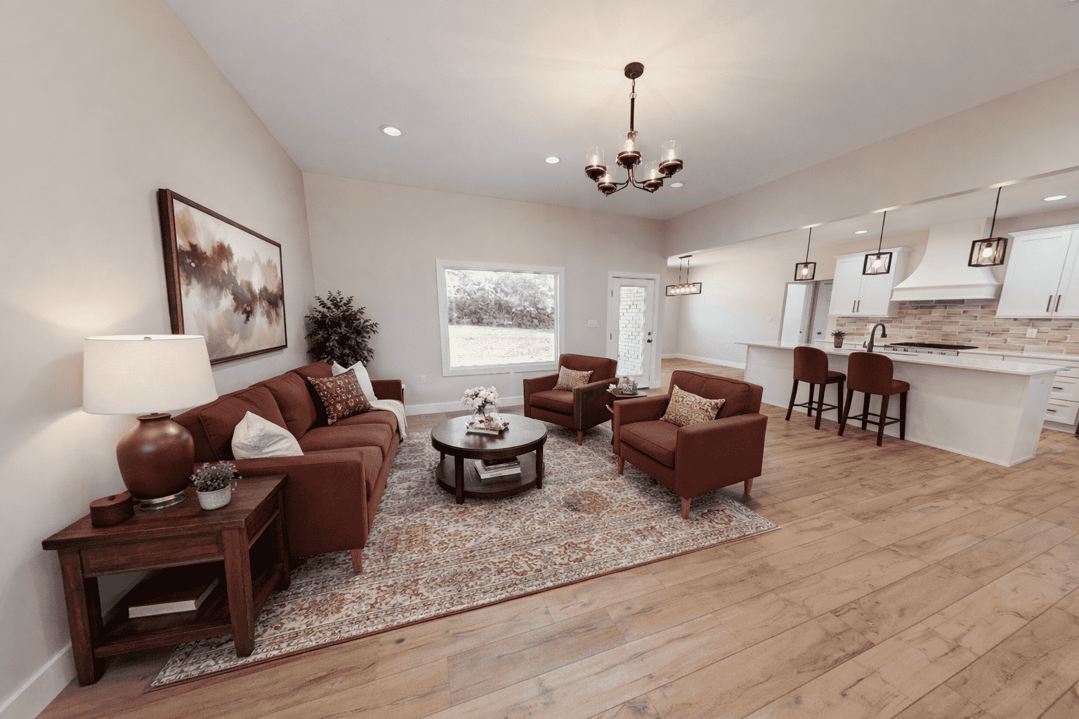 Open-concept living room and farmhouse kitchen at 18800 Wicklow Way in Aurora.