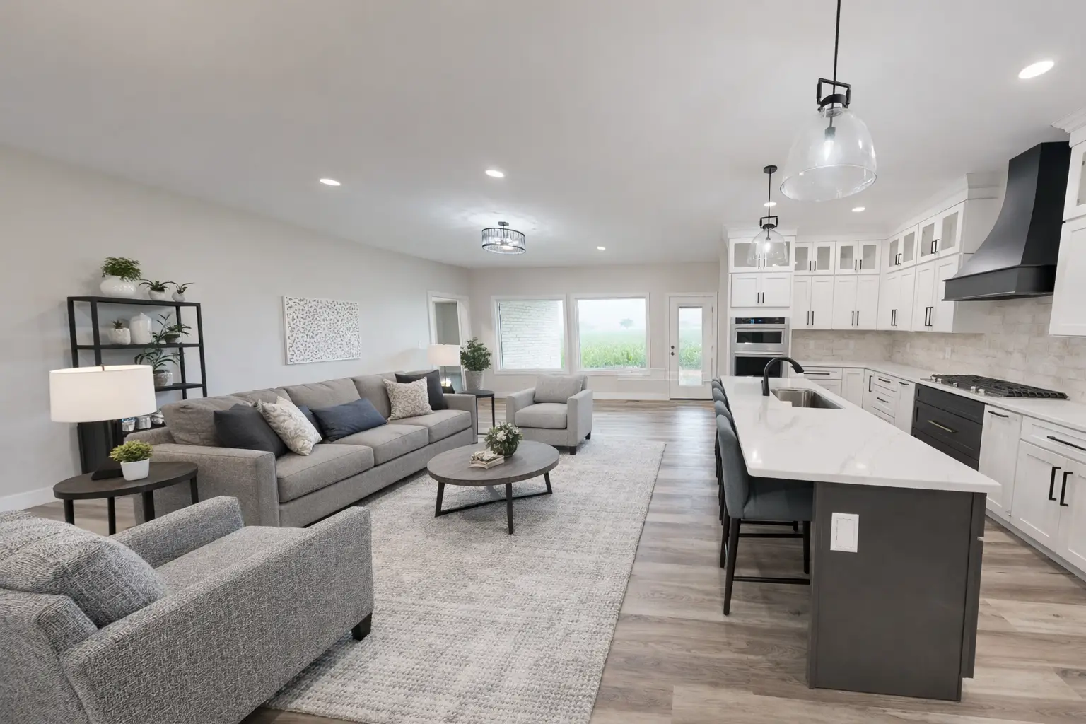 Asher floor plan open-concept living room and kitchen at Chris Brown Homes, 5622 Lenox Drive.