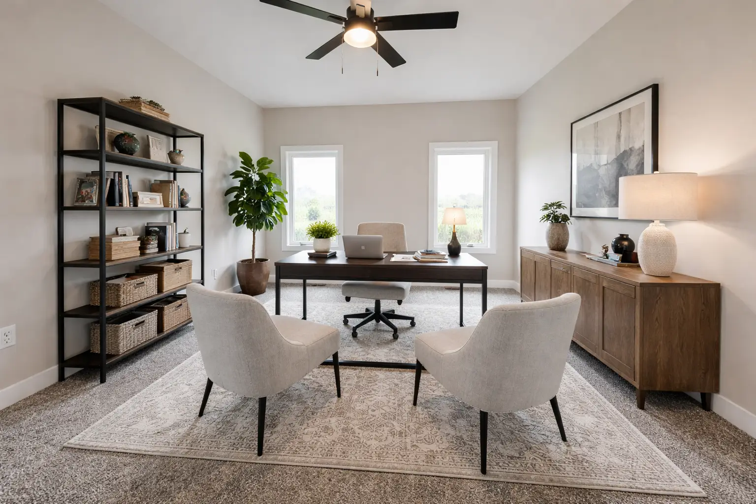 Asher home office by Chris Brown Homes in Aurora with desk, cream armchairs, and shelving.