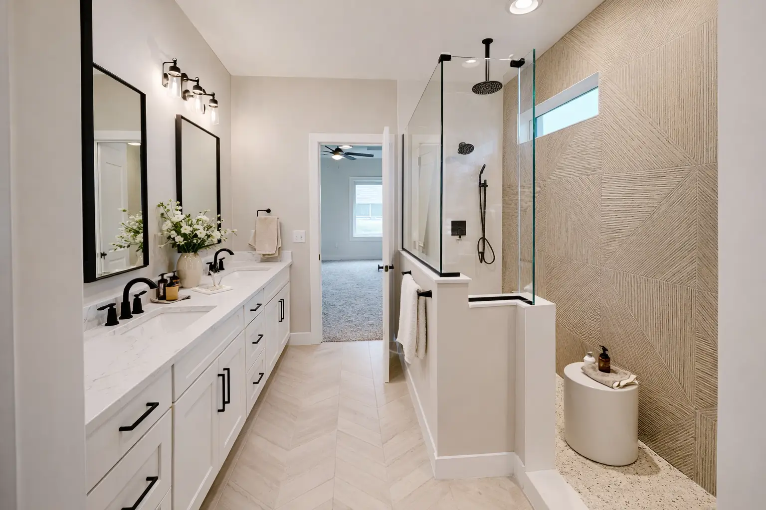 Aurora bathroom at Chris Brown Homes with double vanity and glass-enclosed walk-in shower.