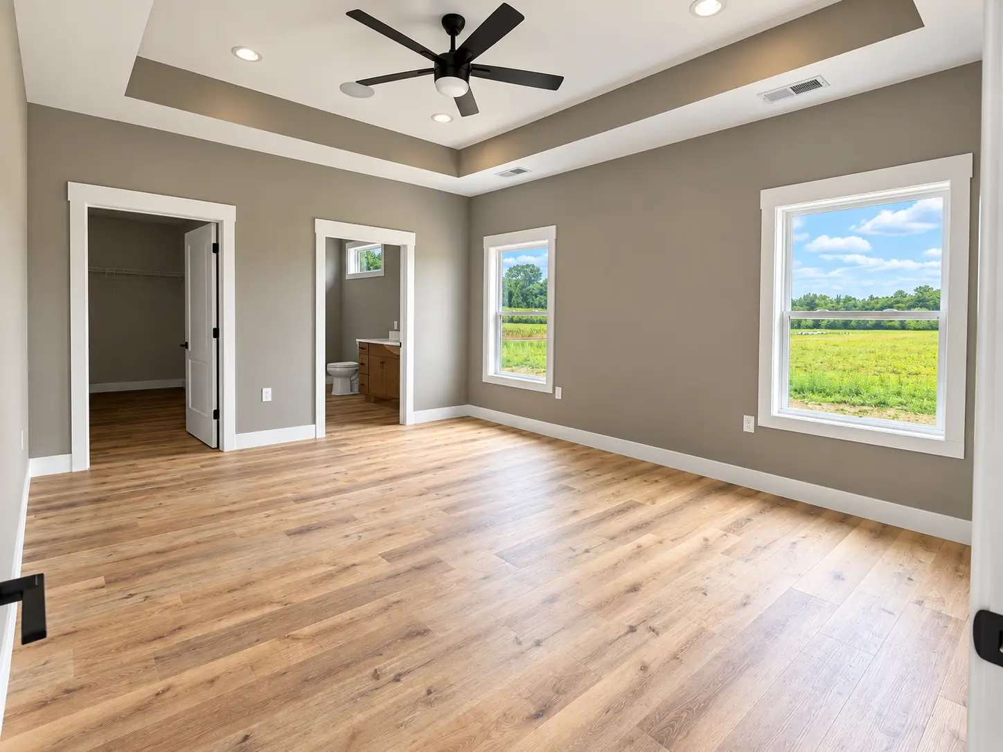 Kirkwood Bedroom With Wood Floors and Tray Ceiling
