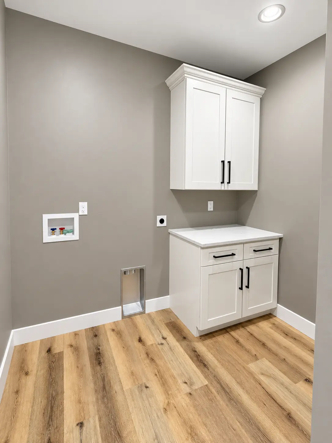 Modern Kirkwood Laundry Room With White Cabinets