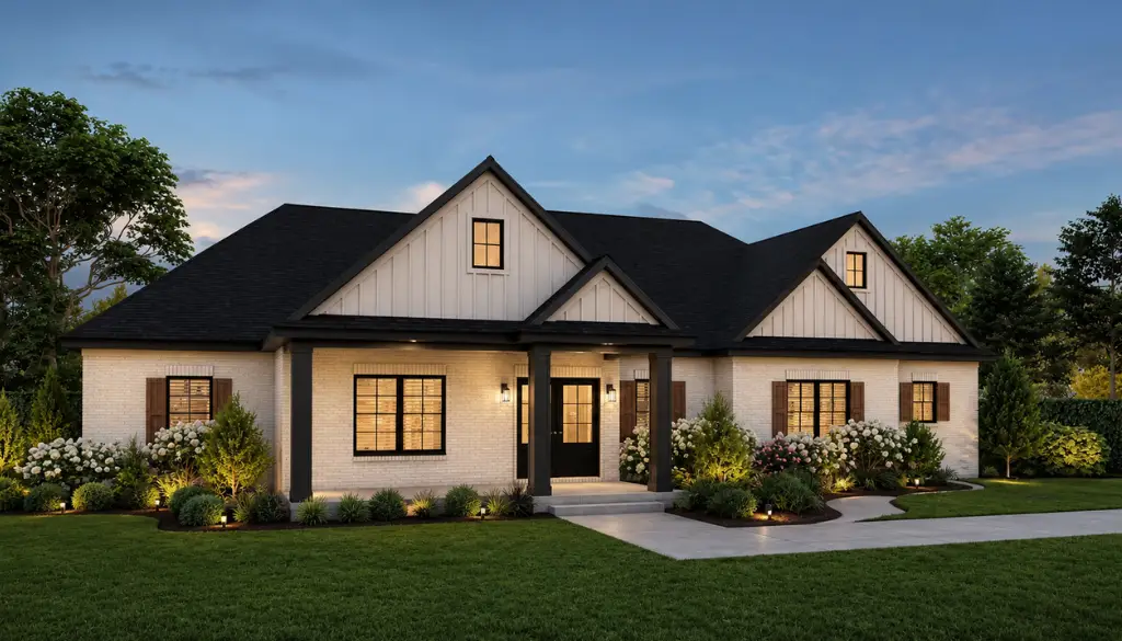 Single-story modern farmhouse with white siding, black roof, large windows, front porch with columns, landscaped garden where a robin perches on a fence post, and a concrete driveway—captured at dusk with lights glowing inside the house.