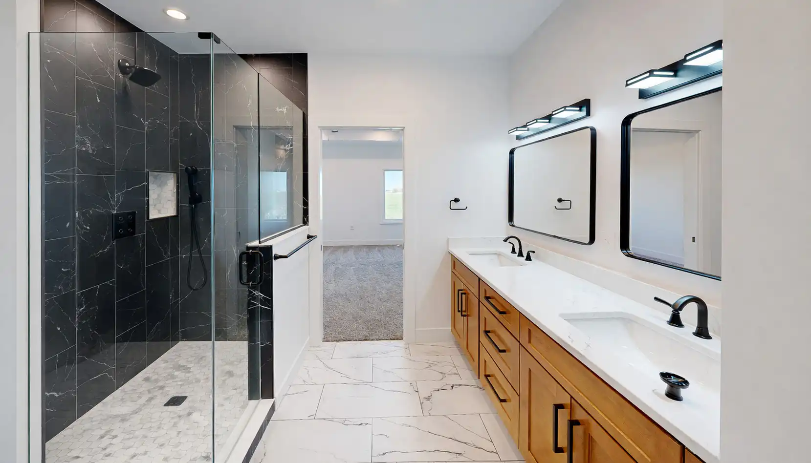 Modern Leo bathroom with black marble shower, wood double vanity, and matte-black fixtures.