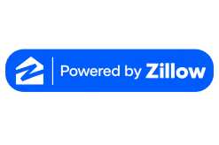 Blue rectangle with a white house logo on the left and the text Powered by Zillow in white and bold blue on the right.